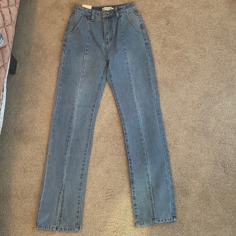 In the Style, new with tags, never worn, boot cut with slit front